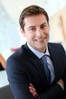 Businessman with arms crossed looking at camera