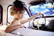 beautiful fashion girl in retro style sitting in old car