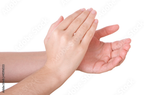 Photo: Hands applauding isolated on a white background Hands applauding isolated on a white background