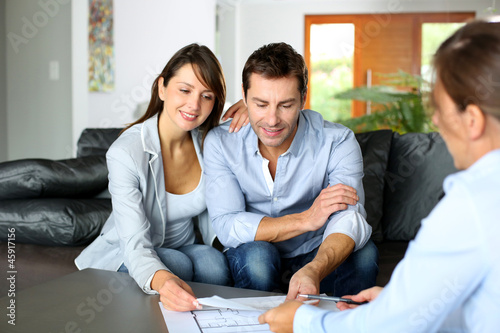 Photo: Couple meeting consultant for financial contract Couple meeting consultant for financial contract