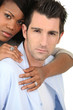 Man hugging woman from behind