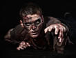 The zombie is lying in the studio