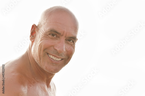 Photo: Portrait of a cheerful man on a white background Portrait of a cheerful man on a white background