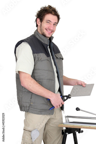 Photo: young tiler working young tiler working