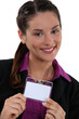 Brunette proudly displaying her business pass