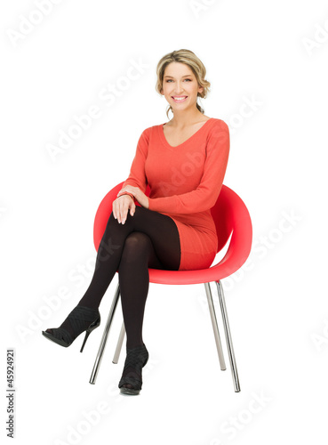 Photo: businesswoman sitting in chair businesswoman sitting in chair