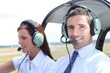 Man and woman in the cockpit of a light aircraft