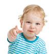 Photo: funny curly child with dirty lips pointing by finger directly to funny curly child with dirty lips pointing by finger directly to