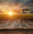 Foto: Wooden table with rural scene in background Wooden table with rural scene in background