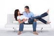 Happy couple on white sofa