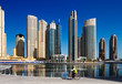 A cyclist cycles the Marina walk, Dubai Marina and JBR