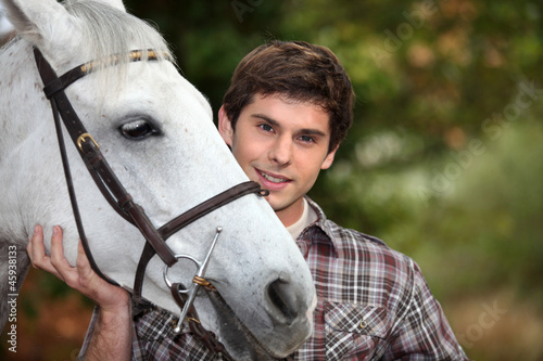 Photo: Teen with white horse Teen with white horse