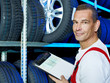 Mechanic looking for the right tires with car registration book