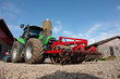 Foto: Modern tractor with a plow Modern tractor with a plow