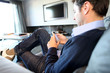 Man sending short message with smartphone