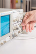 Working with oscilloscope in laboratory