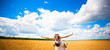 happy couple in the field of wheat with blue sky