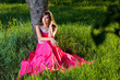 Foto: Woman in a long pink dress Woman in a long pink dress