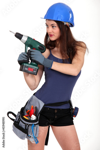 Photo: Woman holding drill Woman holding drill