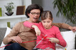 Mother and daughter knitting