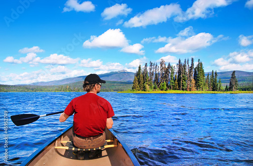 Photo: Canoeing on a lake in the wilderness of British Columbia, Canada Canoeing on a lake in the wilderness of British Columbia, Canada