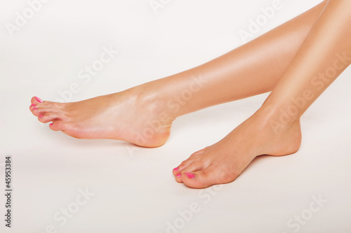 Photo: Female feet with varnished toenails Female feet with varnished toenails