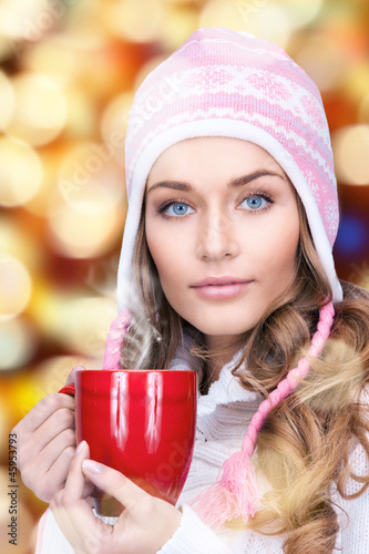 Photo: beautiful woman with red mug beautiful woman with red mug