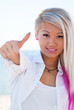Young woman showing thumbs up