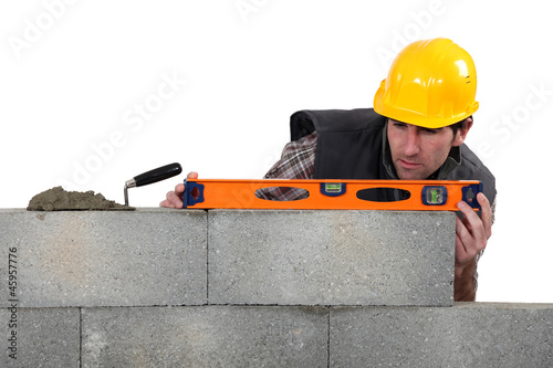 Photo: craftsman mason working with a level craftsman mason working with a level
