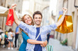 Happy Young Couple with Shopping Bags