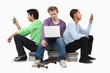 Boys sitting on piles of books