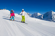 Skiing, winter, ski lesson - skiers on ski run