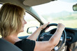 Senior woman driving car