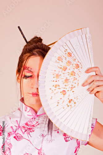 Photo: Traditional woman with a fan Traditional woman with a fan