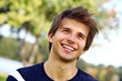 Portrait of young cute man in park