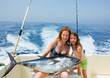 bikini fisher woman and daughter with bluefin tuna