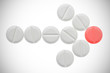 Arrow of white pills ending on red pill