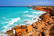 Cala Saona coast with turquoise rough Mediterranean