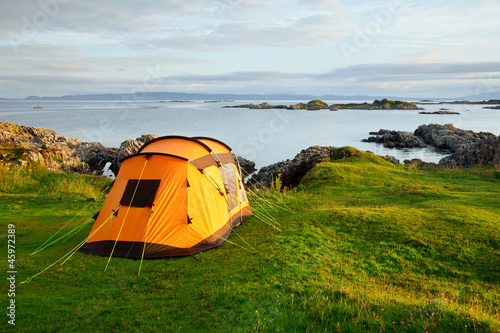 Photo: Camping tent on ocean shore Camping tent on ocean shore