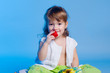 Little girl eating strawberry