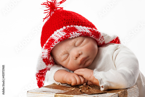 Photo: Baby Doll with Christmas Cap Baby Doll with Christmas Cap