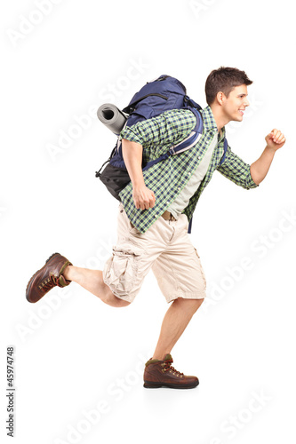 Photo: Hiker with backpack running Hiker with backpack running
