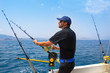 Foto: blue sea fisherman in trolling boat with downrigger blue sea fisherman in trolling boat with downrigger