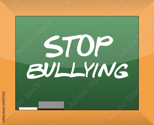 Photo: stop bullying text written on a blackboard stop bullying text written on a blackboard