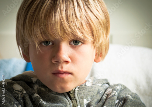Photo: Upset boy with sad eyes Upset boy with sad eyes