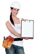 Construction woman with a blank clipboard