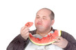 Photo: Fat man savouring a slice of watermelon Fat man savouring a slice of watermelon