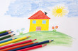 child drawing with pencils
