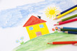 child drawing with pencils