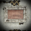 Old frame on a very decrepit wall